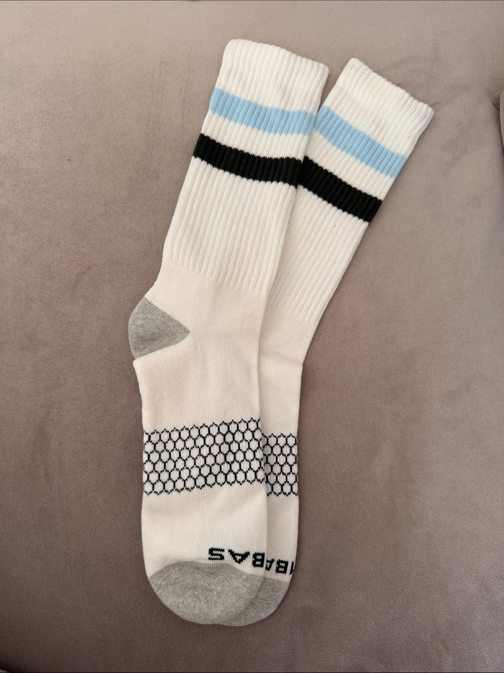 White Athletic Bombas Crew Socks with Light Blue & Green Stripes